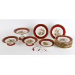 A late 19th century English porcelain claret ground ornithological dessert service