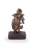 A Chinese gilt and lacquered wood figure of a boy