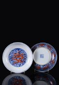 A fine pair of iron-red and underglaze-blue 'Dragon' dishes