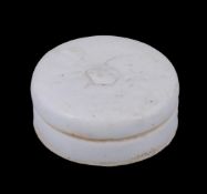 An unusual Chinese circular white-glazed stoneware inkstone and cover