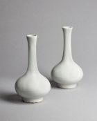 A pair of Chinese white glazed vases