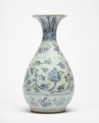 A provincial Chinese blue and white bottle vase