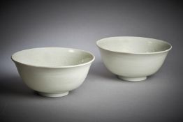 A pair of Chinese white glazed bowls