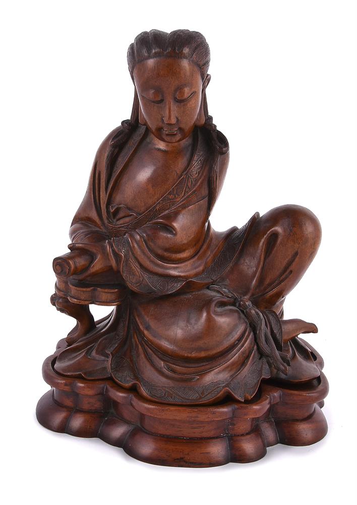 A Chinese stained boxwood figure of Guanyin