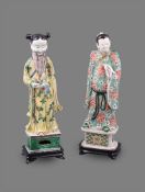 A rare Chinese famille verte biscuit porcelain figure of the standing immortal Lu Dongbin