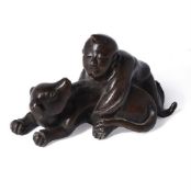 A Chinese bronze group of a boy and a dog