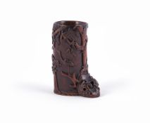 A small Chinese carved wood flower vase