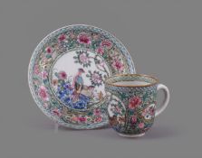 A fine Chinese porcelain Famille Rose loop-handled cup and semi-eggshell saucer
