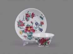 A Chinese porcelain famille rose semi-eggshell tea bowl and saucer