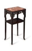 A Chinese hardwood and marble inset two-tier occasional table