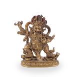 A Sino-Tibetan gilt bronze figure of Mahakala
