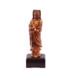 Y A small Chinese ivory figure of Guanyin