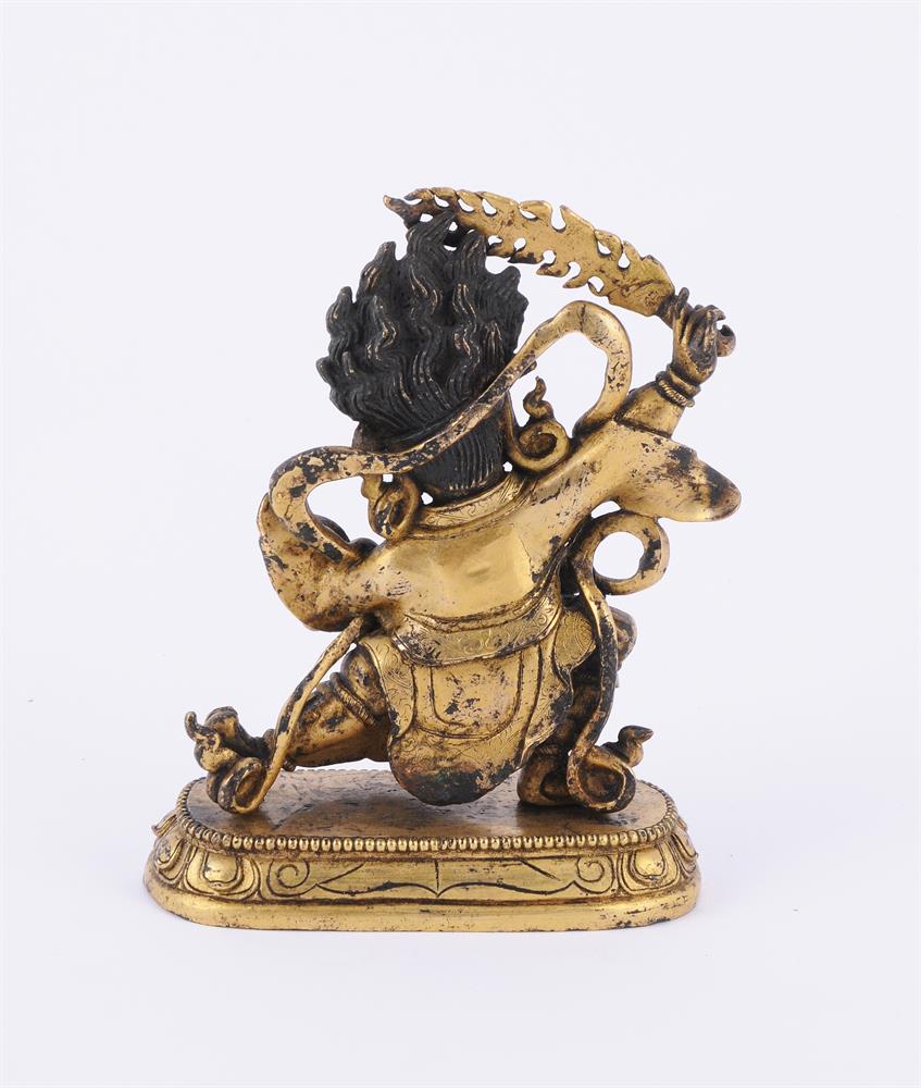 A Sino-Tibetan gilt bronze figure of a Dharmapala - Image 3 of 5