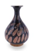 A Chinese russet splashed black glazed bottle vase