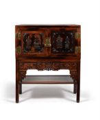 A Chinese hardwood two-door cabinet on stand
