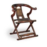A Chinese lacquered wood folding horseshoe back folding chair