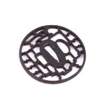 A Japanese Iron Kyo-Sukashi Tsuba of circular form pierced in ji-sukashi with the Yatsuhashi (eight