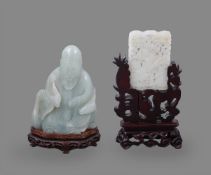 A Chinese celadon jade carving of an immortal