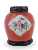 A Chinese coral-ground Famille Rose ginger jar