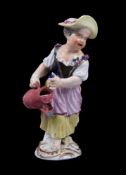 A Meissen figure of a girl with watering can