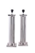 A pair of columnar chromed metal table lamps