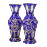 A pair of clear, opaque-white, and blue glass overlay baluster vases