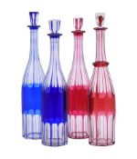 Four various Val St. Lambert ruby and blue overlay glass slender bottles