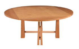A light oak and maple circular dining table