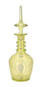 A pale yellow tint decanter and spier shaped stopper