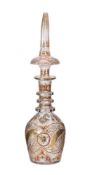 A clear cut glass decanter and spier shaped stopper
