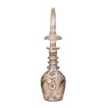 A clear cut glass decanter and spier shaped stopper