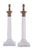 A pair of cut glass and gilt metal mounted columnar table lamps