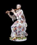 A Meissen figure of a seated female flautist from the Gallant Orchestra and modelled by J.J. Kaendle