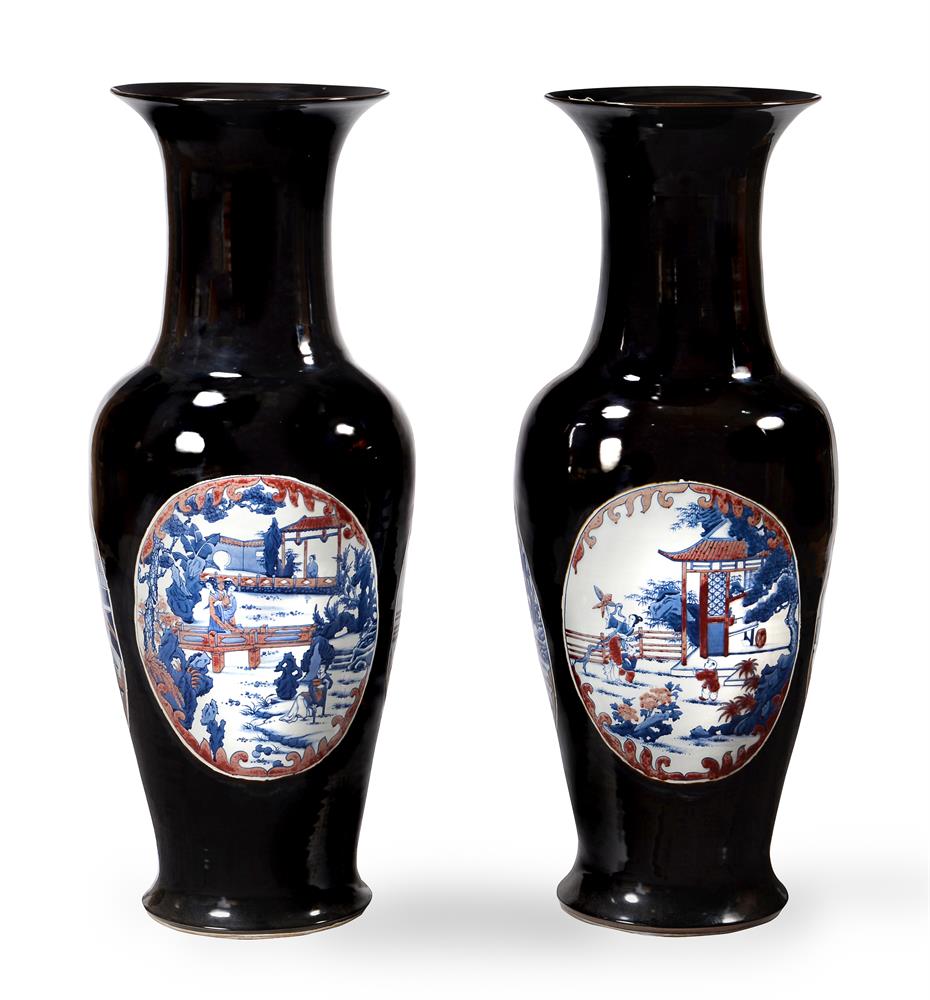 A large pair of Chinese black glazed baluster vases