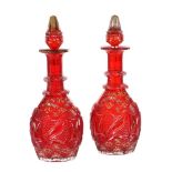 A pair of ruby-flashed decanters and stoppers for the Near Eastern market