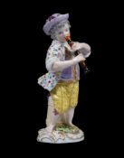 A Meissen figure of a boy playing the flute