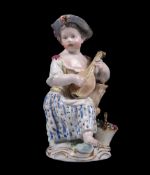 A Meissen figure of a girl playing the lute