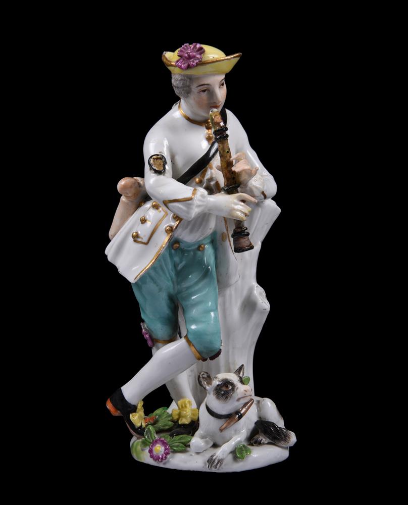 A Meissen figure of a shepherd playing the flute