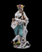 A Meissen figure of a shepherd playing the flute