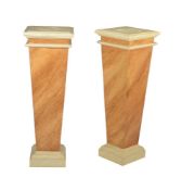 A pair of simulated marble pedestals