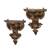 A pair of carved gilt wood brackets