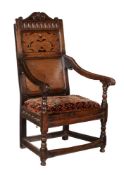 An oak and inlaid wainscot armchair