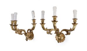 A pair of French gilt bronze three light wall appliques in Restauration style, later 19th century
