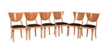 A set of six satinwood and ebonised dining chairs