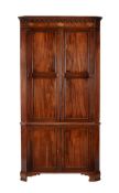 A George III mahogany standing corner cabinet