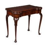 A mahogany folding card table in George II Irish style