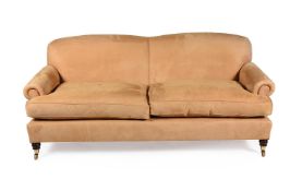 A tan suede style upholstered sofa