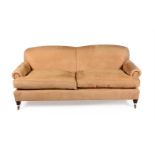 A tan suede style upholstered sofa