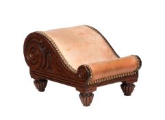 A late Regency carved mahogany and leather upholstered foot or gout stool