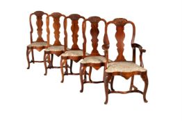 A set of ten walnut chairs